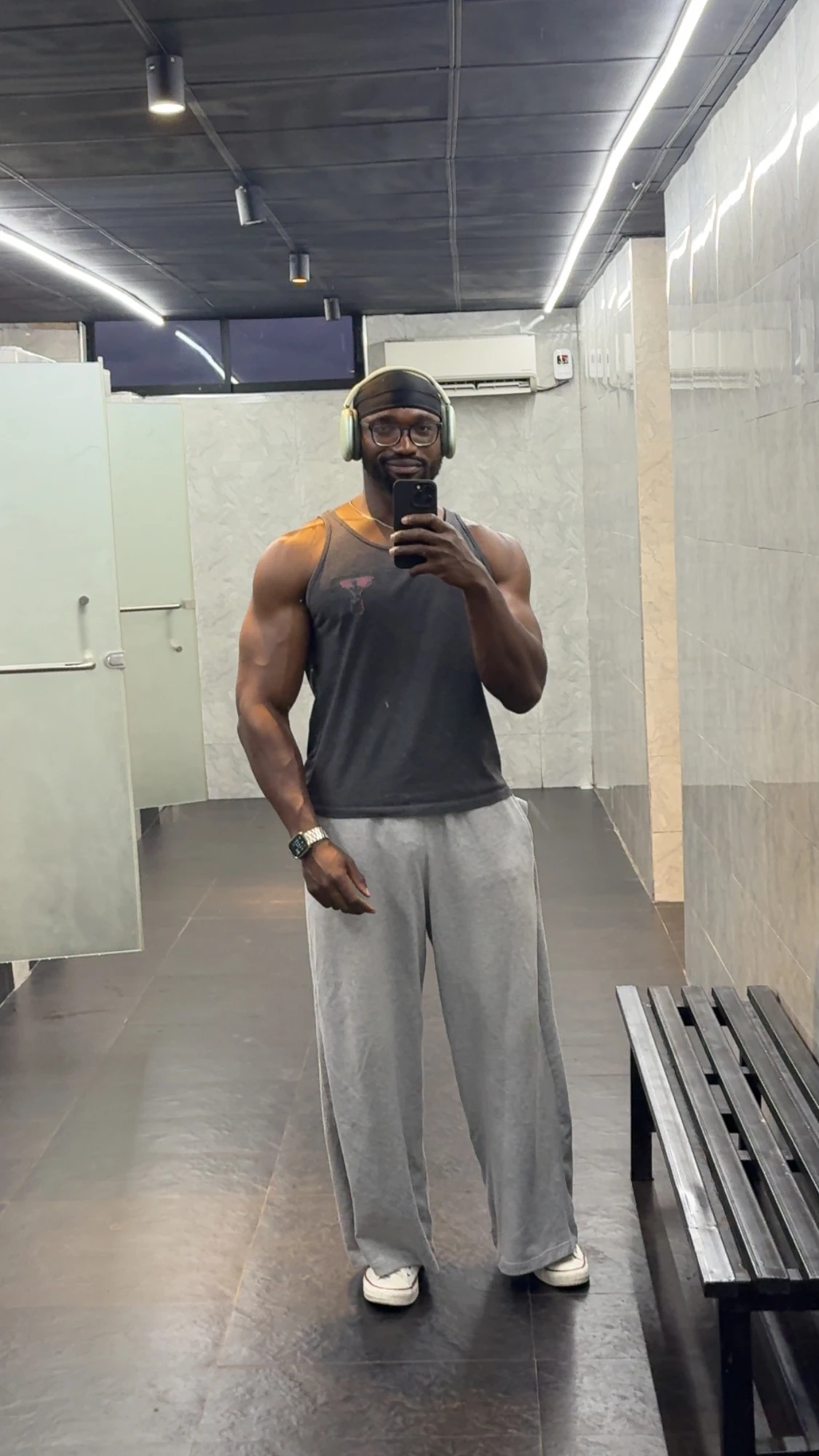 Samuel taking a gym mirror photograph
